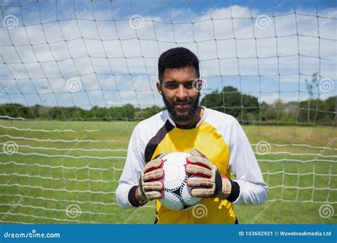 Goalkeeper With Ball Standing In Front Of Goal Post Stock Image Image