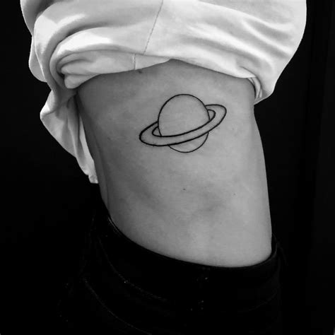 Saturn Tattoo On The Right Rib Cage Tattoogrid Net