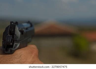 Hand Holding Hand Gun Stock Photo 2270057475 | Shutterstock