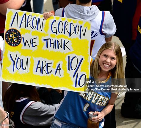 A Denver Nuggets Fan Shows Support For Player Aaron Gordon Along The