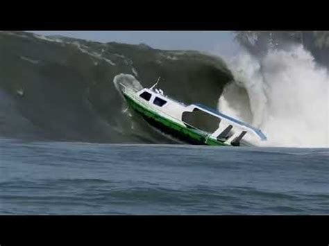 A Boat In The Middle Of A Large Wave