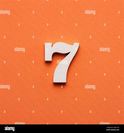Number 7 - White wooden number on pink background Stock Photo - Alamy