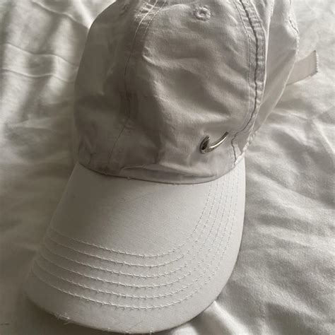 White metal swoosh Nike hat that’s adjustable and used - Depop