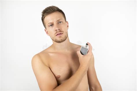 Image Of Handsome Fit Man With Naked Torso Holding Parfume White