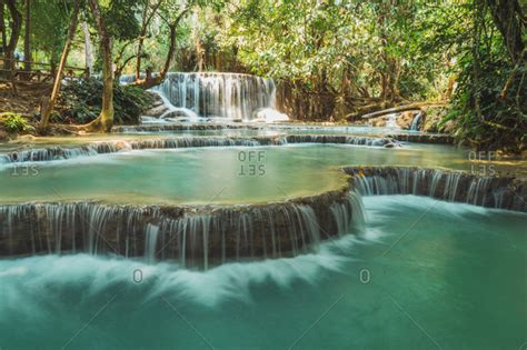 Beautiful small waterfalls flowing stock photo - OFFSET