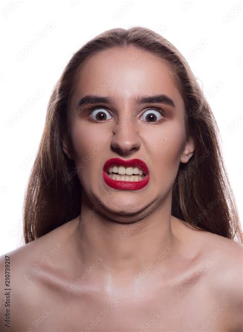Closeup Portrait Of Angry Brunette Girl With Bright Makeup Posing On A White Background Stock