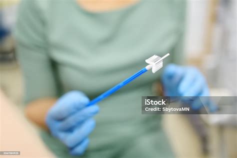 Gynecologist Examines A Patient Takes A Smear From A Woman Cervix Close