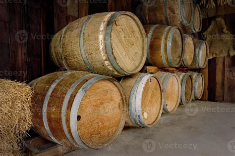 Old Wooden Barrels Stacked In Winery Stock Photo At Vecteezy