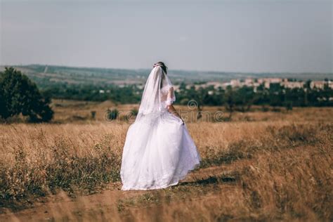 Romantic Beautiful Bride Woman In A Wedding Dress Runs Across The