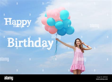 Happy Birthday Text And Beautiful Young Woman With Colorful Balloons