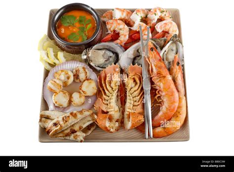 Seafood Feast On A Plate With Hot And Cold Seafood And Sauce Oysters Prawns Shrimp Fish Scallops