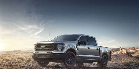 The New Ford F 150 Pickup Truck Is Driving On A Rocky Trail In The Desert