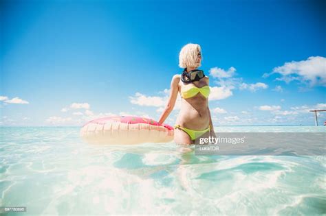 Blonde Woman Standing In Shallow Water With Snorkel Equipment Maldives