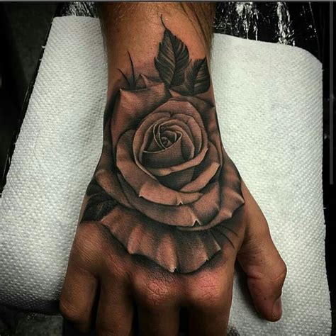 Pin By Abagail Tubville On Tattoo Parlor Hand Tattoos For Guys Hand Tattoos Rose Tattoos For Men