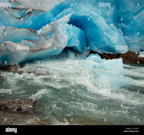 Nigardsbreen Glacier Foot Cave And Melting Ice Stream Close Up View