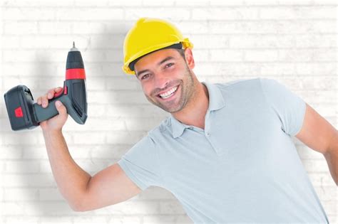 Premium Photo Composite Image Of Smiling Repairman Holding Power Drill