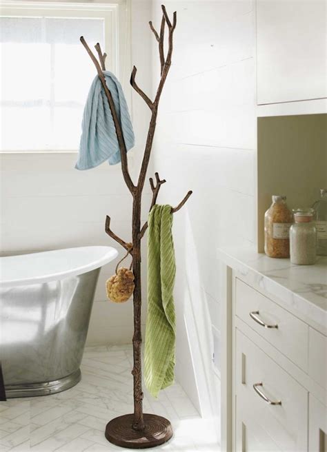 Recycled metal branch coat tree in bathroom - Decoist