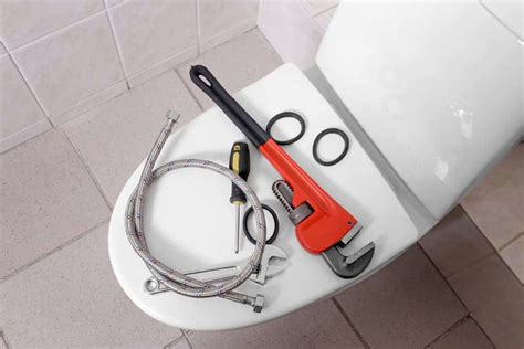 Leaking Toilet Tank Repair - dismantle the toilet