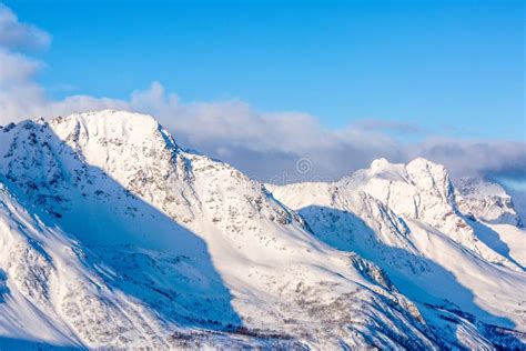 Snowy peaks of mountains stock image. Image of norway - 131012919