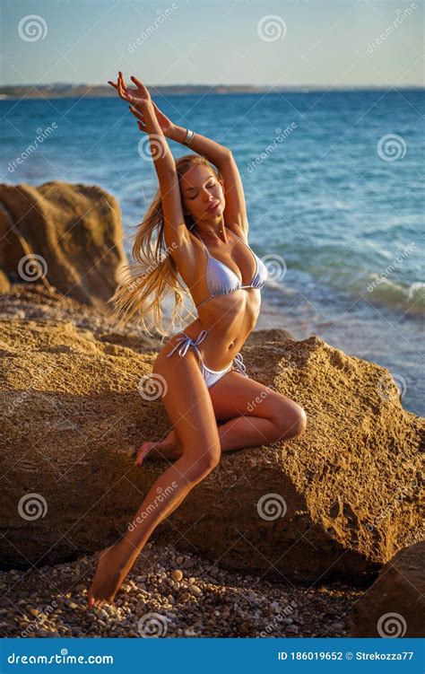 Fashion Outdoor Photo Of Beautiful Woman With Blond Hair In Bikini