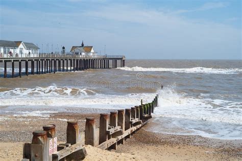 Waves Hitting the Groynes on Southwold Beach with the Pier in the ...