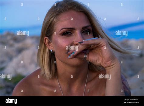 Beautiful Blonde Caucasian Woman Outdoor At Adriatic Sea In Croatia Europe Warm Dusk Evening