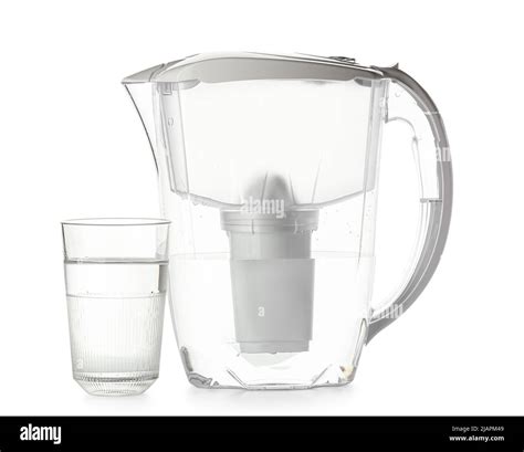 Modern filter jug and glass of water on white background Stock Photo - Alamy