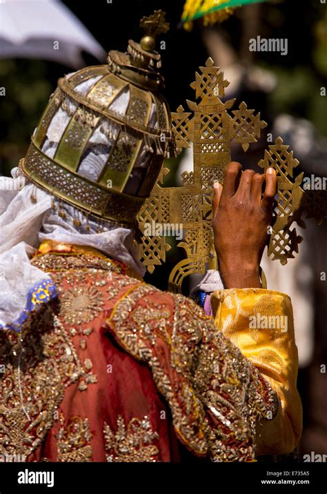 Ethiopian Orthodox Priest Holding A Cross During The Colorful Timkat