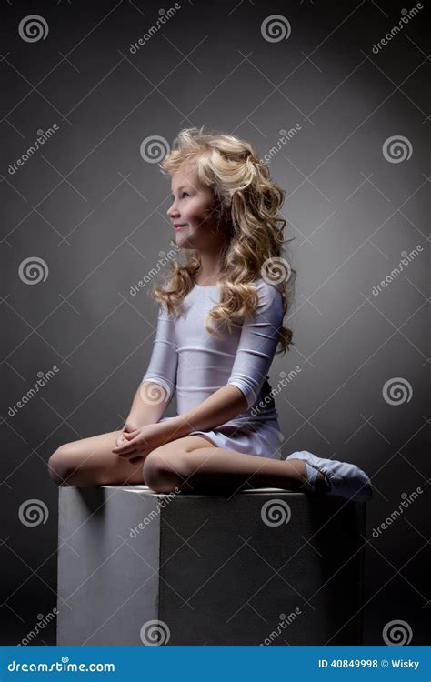 Joyful Blonde Gymnast Posing On Cube In Studio Stock Photo Image Of Professional Aerobics