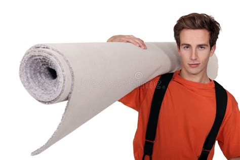 Man carrying carpet stock image. Image of bright, home - 35737931