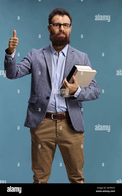 Bearded Man With Glasses Holding Books And Showing Thumbs Up Isolated