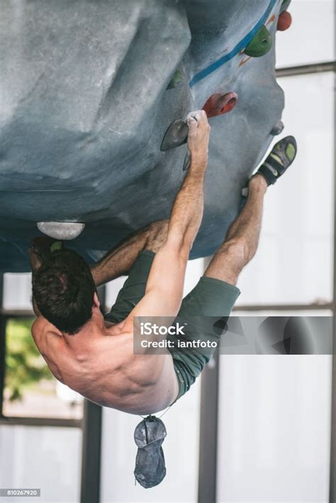 Man Bouldering And Climbing Indoor Stock Photo Download Image Now