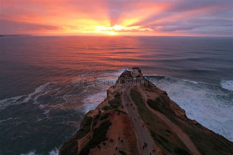 Beautiful Sunset Ower the Fort of Nazare with Lighthouse, Portugal. Stock Image - Image of ...