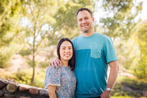 Outdoor Portrait Of Biracial Chinese And Caucasian Couple