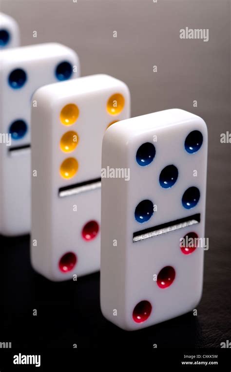 Dominoes Lined Up In A Row On A Gray Background Stock Photo Alamy