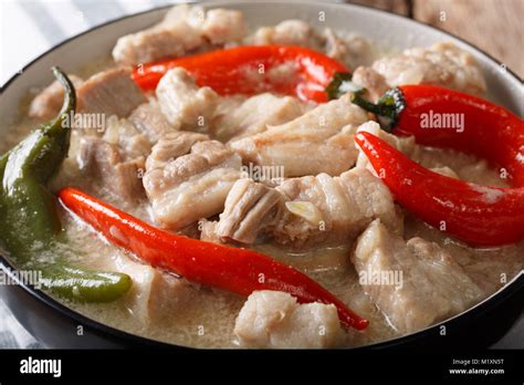 Filipino Bicol Express From Spiced Pork In Coconut Milk Close Up In A