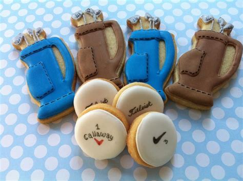 Cookies Decorated To Look Like Tennis Gear And Shoes Are On A Blue