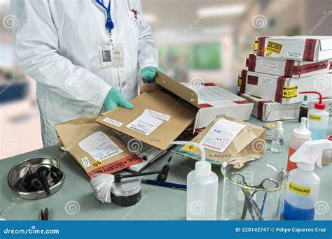 Forensic Police Check Files Against Evidence In Crime Lab Stock Image