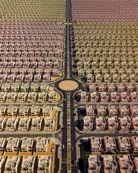 An Aerial View Of Many Rows Of Houses And Roads In The Middle Of A Desert