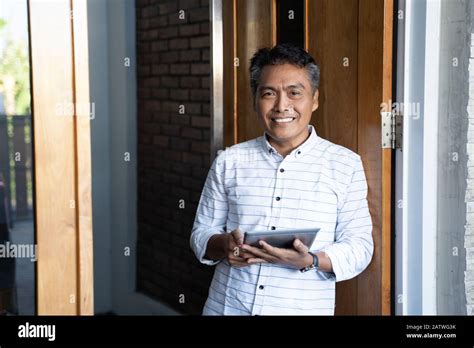 Asian Mature Businessman Using Tablet Pc Connect Trough Technology Stock Photo Alamy