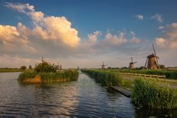 Old Dutch Windmill At Sunset In Kinderdijk Netherlands Featuring Old