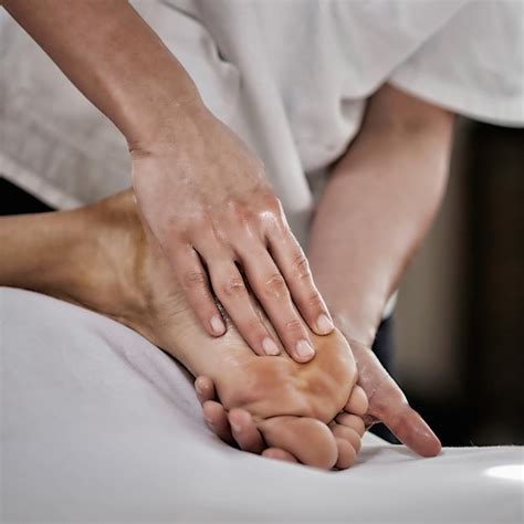 Premium Photo Physical Therapist Doing Massage Of Males Foot