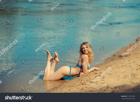 Sexy Blonde Bikini Girl Posing On Shutterstock