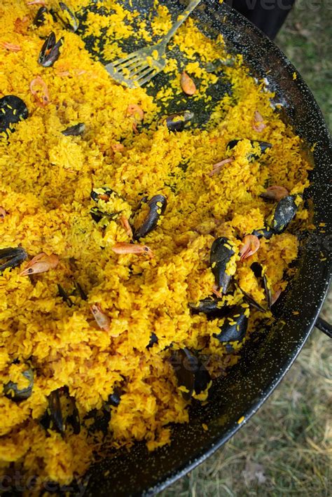 Paella traditional Spanish food. paella prepared on a large pan on the ...