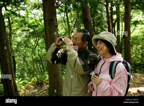 Mature Couple Relaxing In A Park Stock Photo Alamy