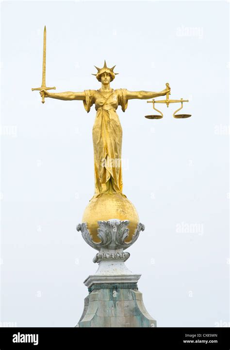 The gold bronze Lady Justice statue with sword and scales above the Central Criminal Court, Old ...