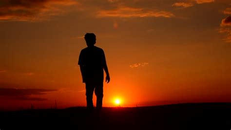 Man With Backpack Mans Silhouette At The Sunset Man Is Standing