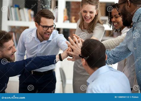 Excited Motivated Multi Ethnic Team People Give High Five In Office