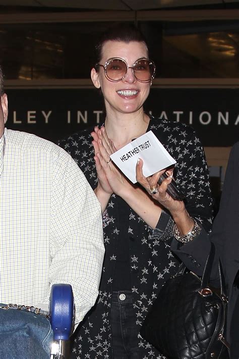 Milla Jovovich At Lax Airport In Los Angeles 12122017 Hawtcelebs