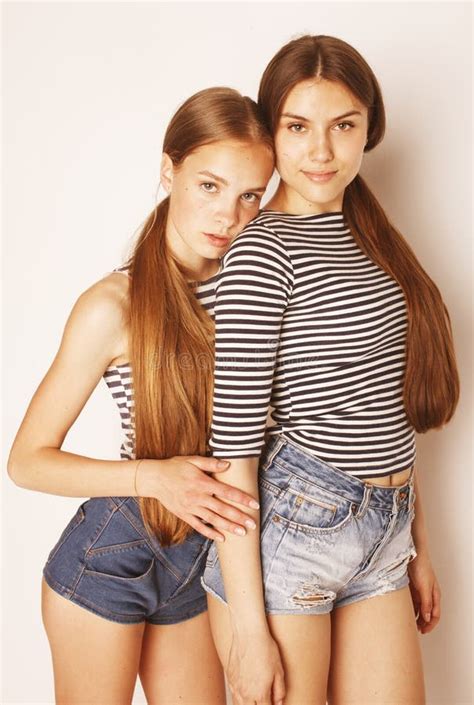 Two Cute Teenagers Having Fun Together Isolated On White Stock Image